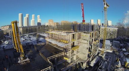 view to construction with crane where are building new house