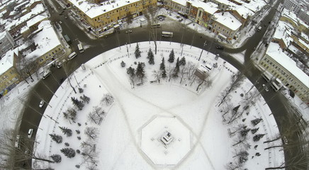 Top aerial view to round Square with Lenin monument in winter.