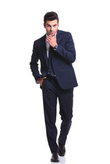 handsome business man scratching his chin