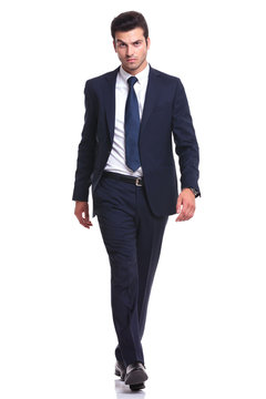 elegant business man walking on white background