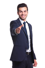 business man putting his hand out to make a deal