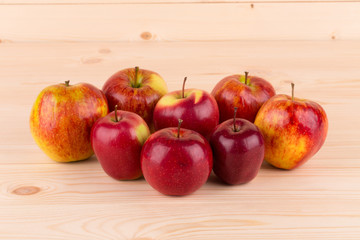 Fresh red apples on wood.