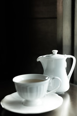 Cup of tea with teapot