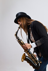 young beautiful woman with saxophone