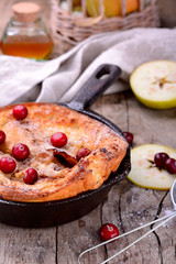 Dutch baby pancake with apple cinnamon and fresh blueberry
