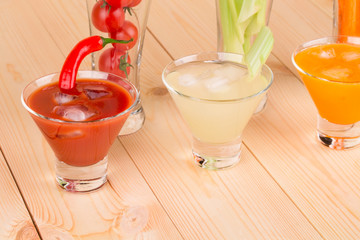Fresh vegetables juices in glasses.