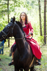 Fototapeta premium brunette girl on horse