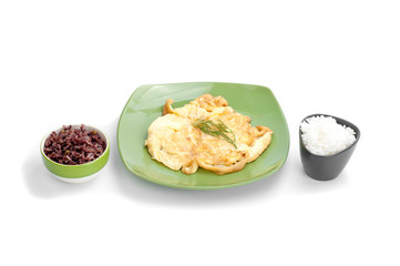 Scrambled eggs, white rice and black rice on white background.