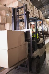 Driver operating forklift machine