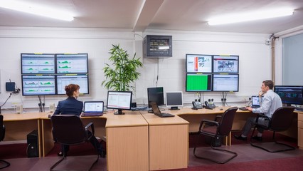 Technicians sitting in office running diagnostics