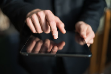 man holding digital tablet, closeup