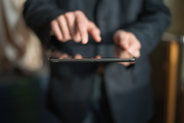 man holding digital tablet, closeup