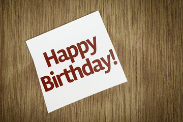 Happy Birthday on Paper Note on texture background