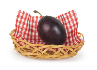One plum in a basket