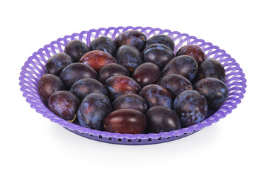 Blue plums in a purple plate