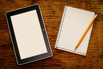 Blank notepad with a tablet computer and pencil