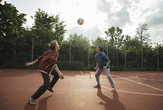 Two boys playing soccer