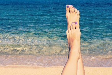Relaxing on the beach with legs up. Sexy legs. Retro look