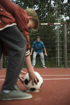 Two boys playing soccer