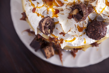 Meringue cake which ferrero rocher and caramel. From above