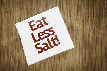 Eat Less Salt on Paper Note with texture background