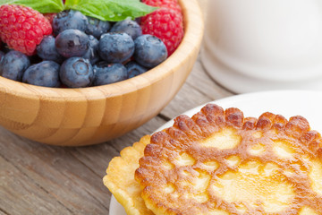 Pancakes with raspberry, blueberry and milk