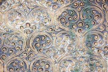 grunge golden spiral texture on the wall