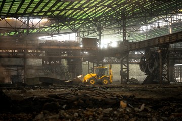 Industrial interior with bulldozer inside