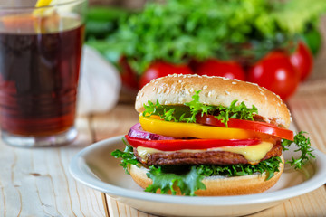 close up of homemade hamburger on white plate