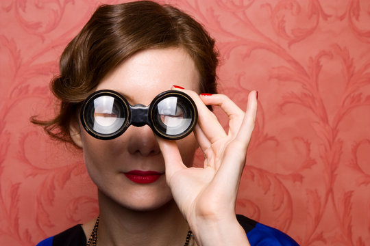 1920's Young Woman Looking Through Theatre Binoculars.