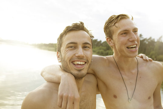 Two friends having fun at quarry pond