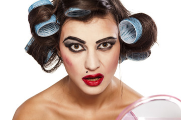 Funny woman with curlers and bad makeup
