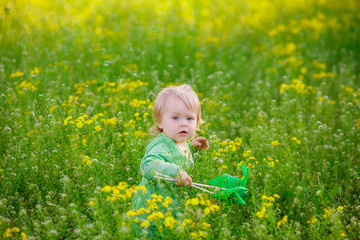 happy child in a field with yellow flowers