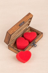 red hearts in a wooden box