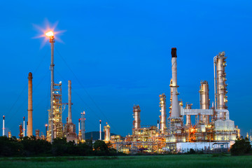 beautiful lighting of oil refinery palnt against dusky blue sky