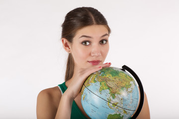 girl is hold the globe in her hands