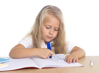 cute little schoogirl happy on desk drawing with marker