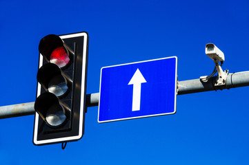 Traffic lights over blue sky