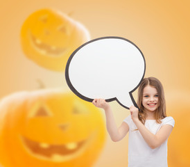 smiling little girl holding big white text bubble