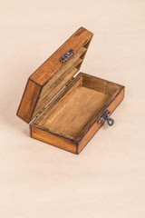 an empty wooden box (casket)