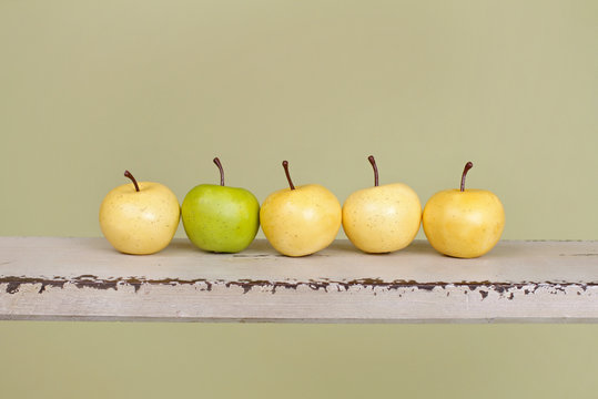 Row of Apples on Rustic Wood Bench