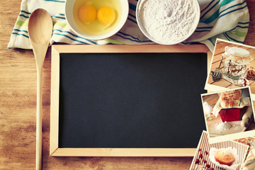 Top view of blackboard and wooden spoon over wooden table and co