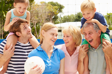 Multi Generation Family Playing Volleyball Together