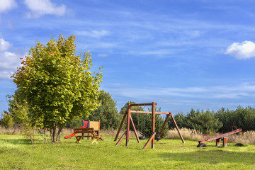 Fototapeta na wymiar Playground on a fresh air in sunny day.