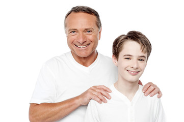 Cheerful mature father and son posing
