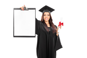 Female graduate student holding a clipboard