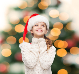 dreaming girl in santa helper hat