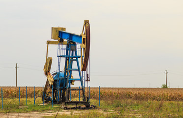 Fototapeta premium Active oil and gas pump in remote rural area