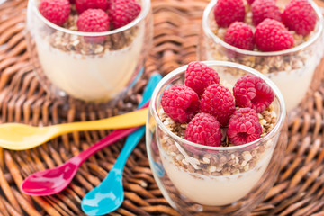 Yogurt with muesli and fresh raspberries