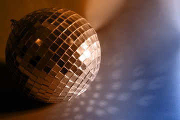 Disco ball on color background